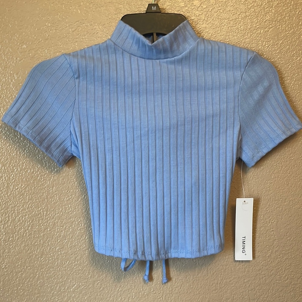 Blue high neck crop top with open back and tie. Size:M- could fit small/ medium.